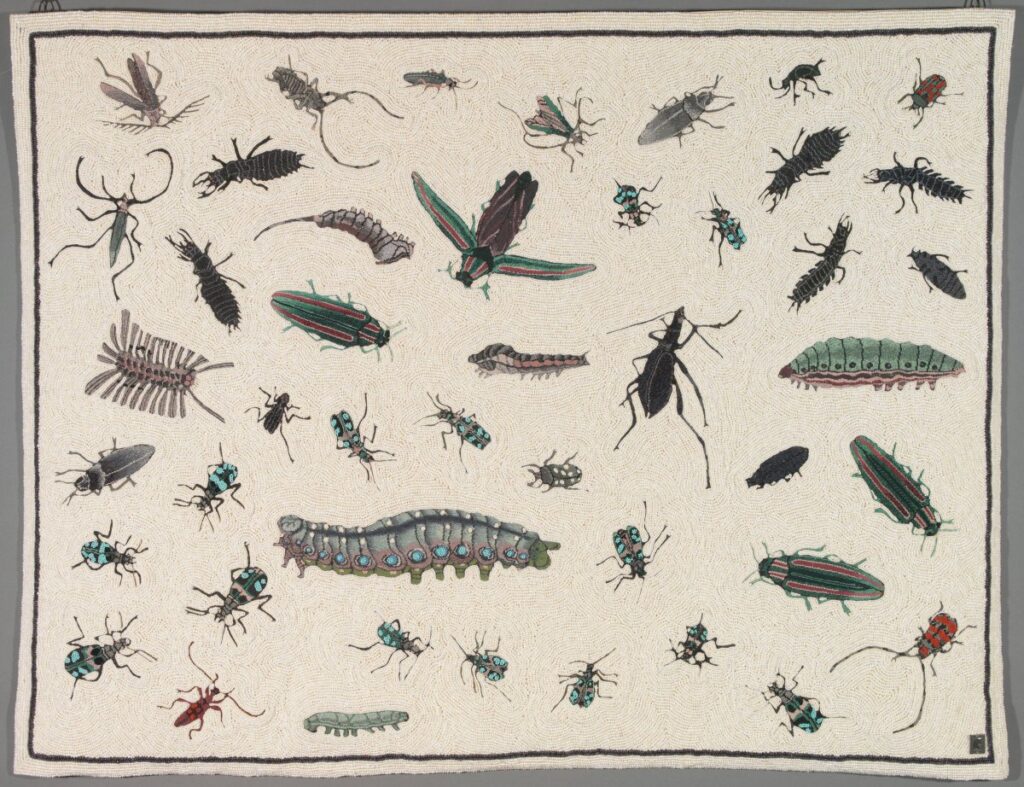 insects embroidered on a tapastry.