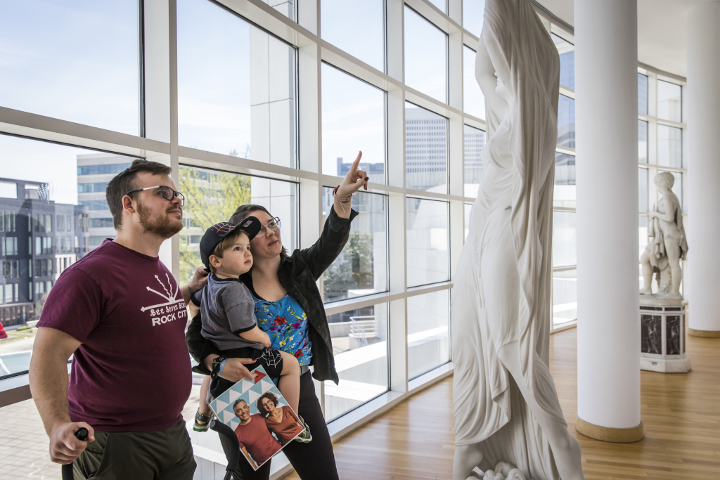 High Activities, 3.20.24. A family pointing at a sculpture in a bright museum gallery.